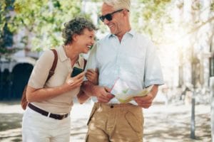 Retired couple enjoying financial freedom while walking around town, considering retirement mortgage options in Ontario - Mortgage Scout