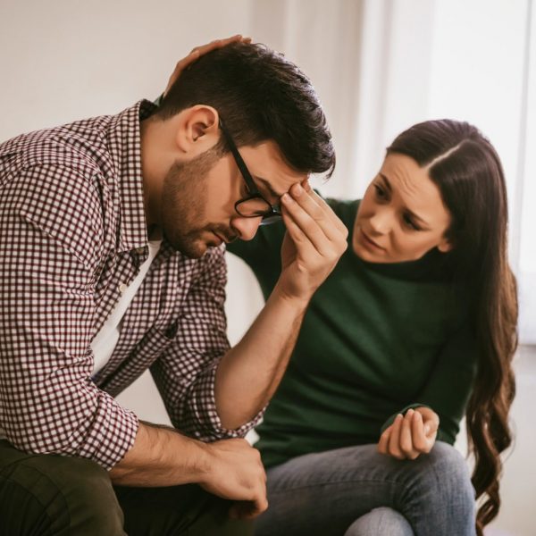 Woman consoling her partner under financial stress, seeking mortgage advice in Ontario - Mortgage Scout